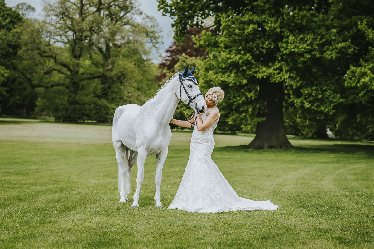 bride with horse at sandon hall